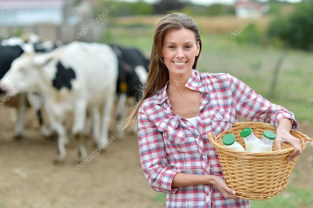 Young Farmer Milking Cows